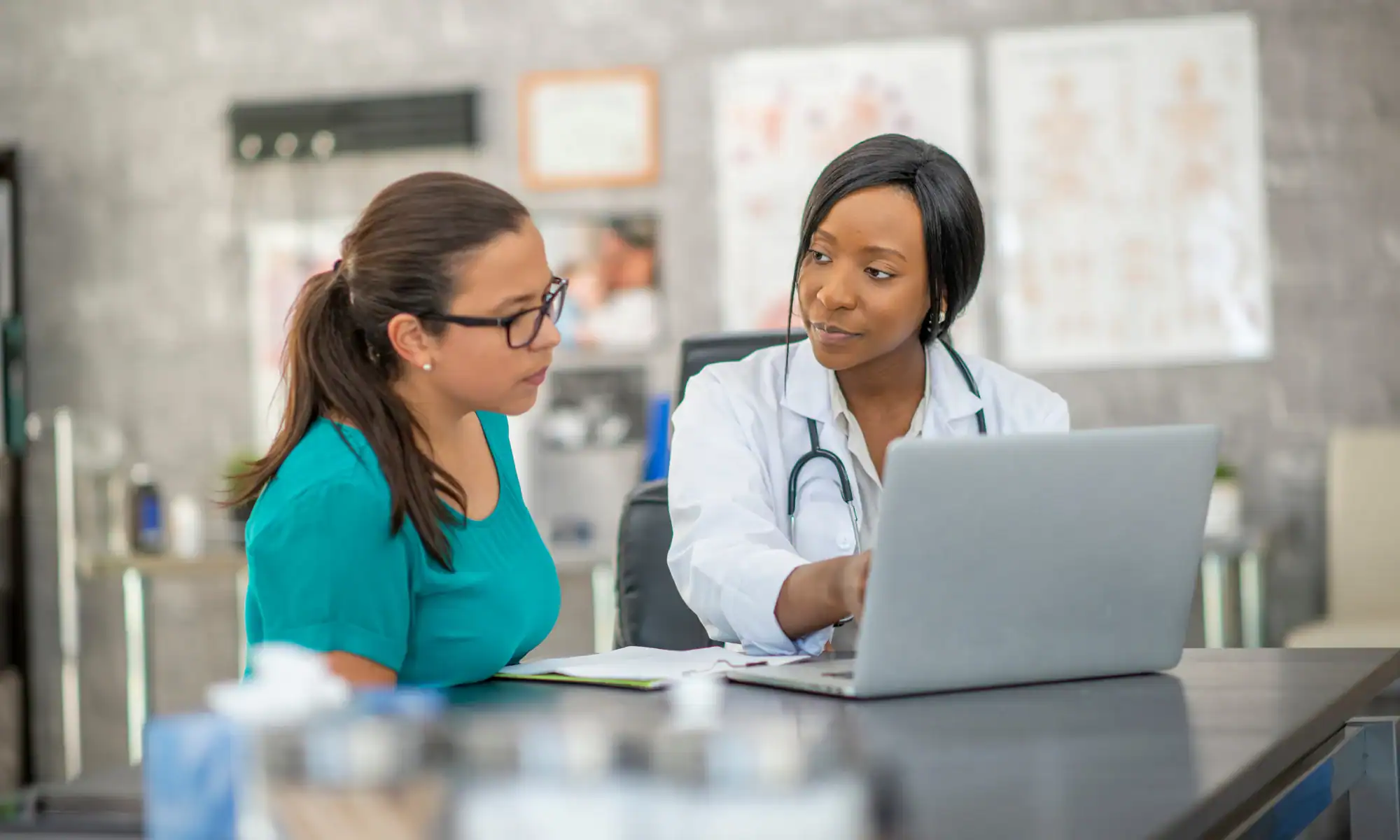 Doctor consulting with patient about semaglutide weight loss treatment at Slim Care clinic in Tulsa