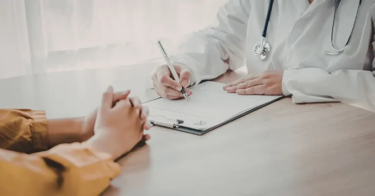 Doctor discussing tirzepatide side effects and treatment with a patient during a medical consultation.