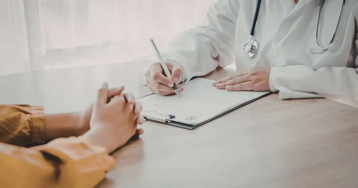Doctor discussing tirzepatide side effects and treatment with a patient during a medical consultation.